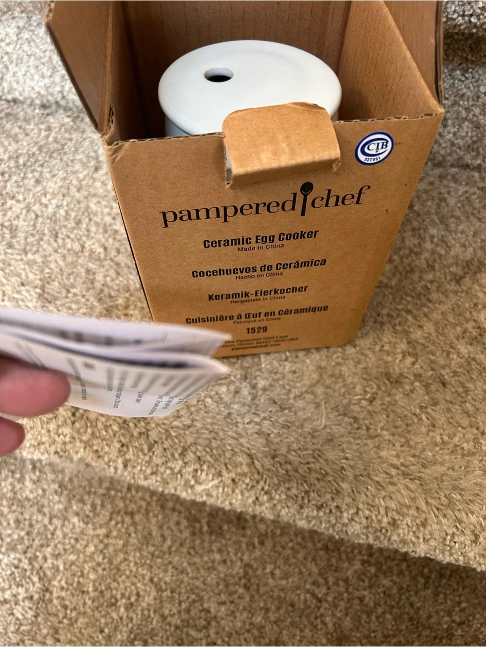 NIB Pampered Chef Ceramic Egg Cooker with Silicone Sleeve and Directions.